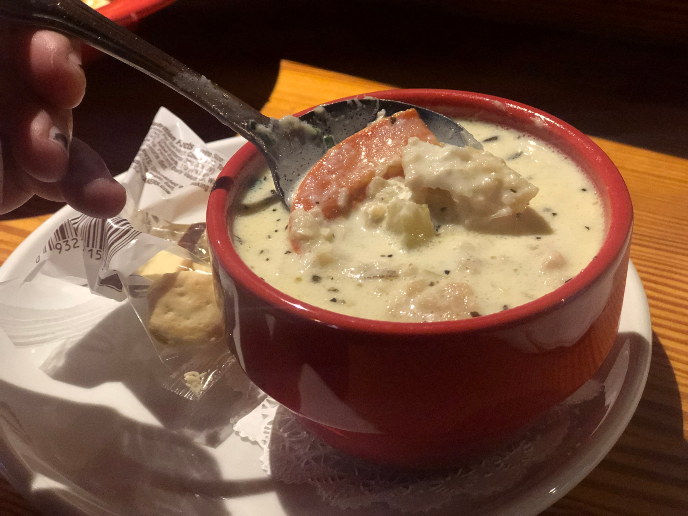 a bowl of seafood chowder on a table