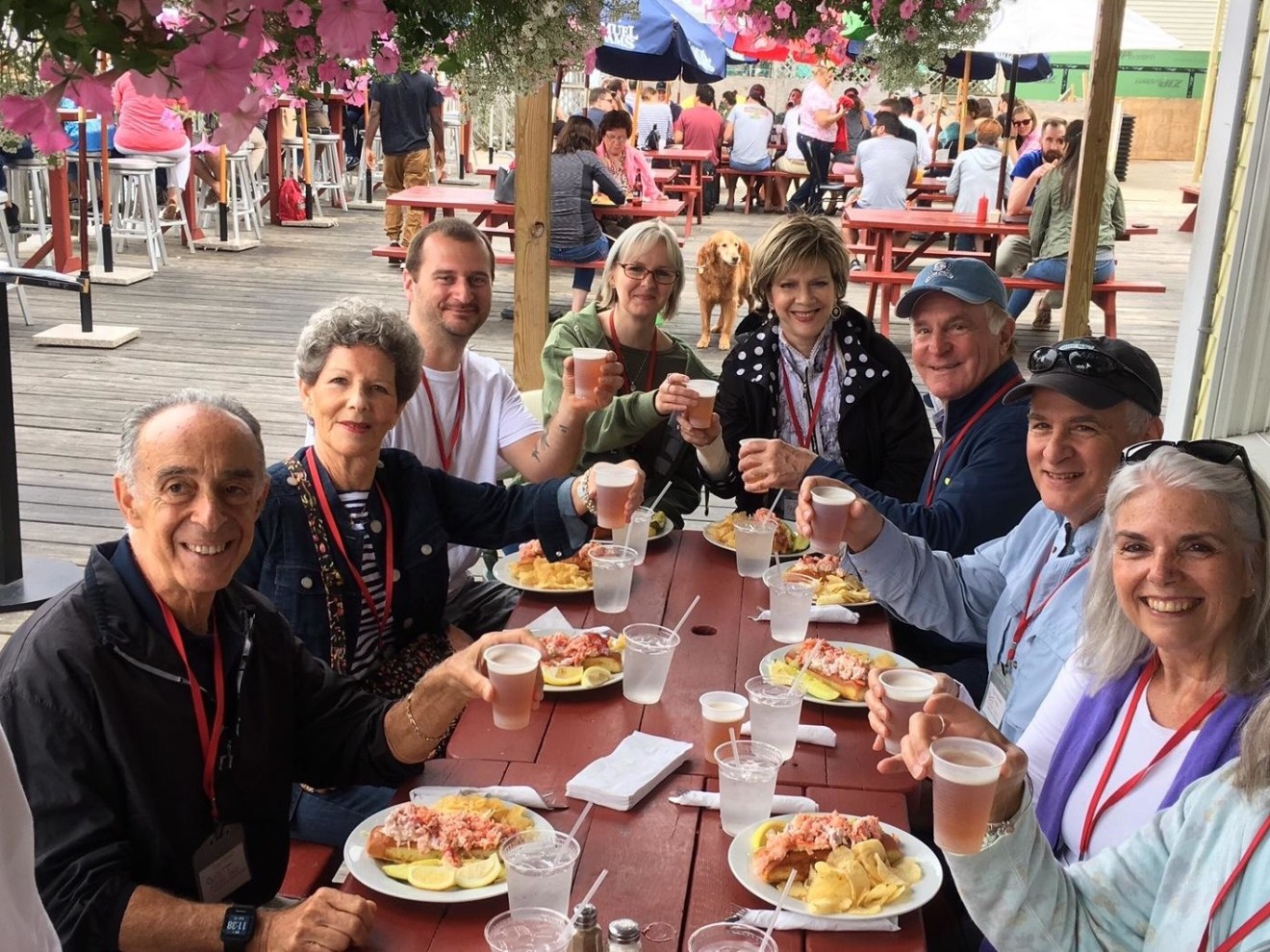 group of people eating lobster rolls