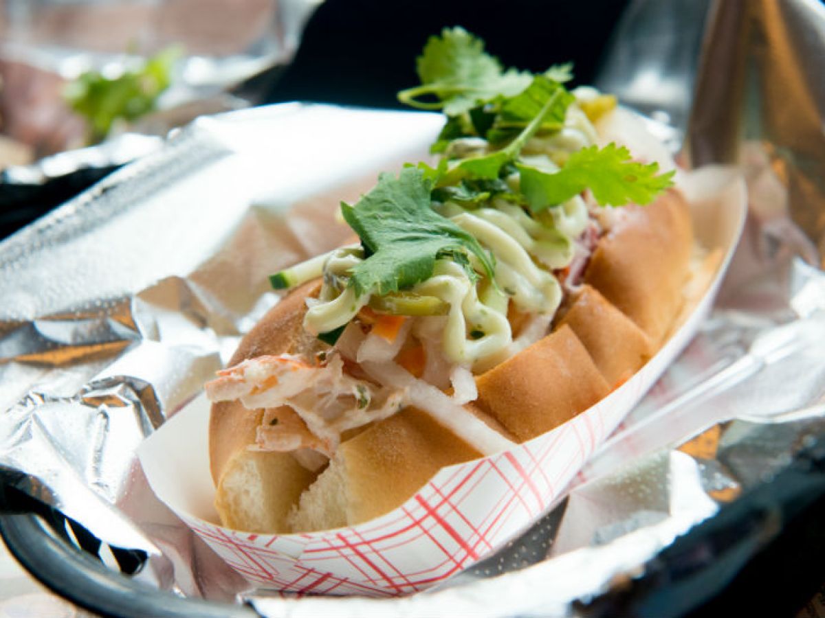 a close up of a Maine lobster roll on a plate