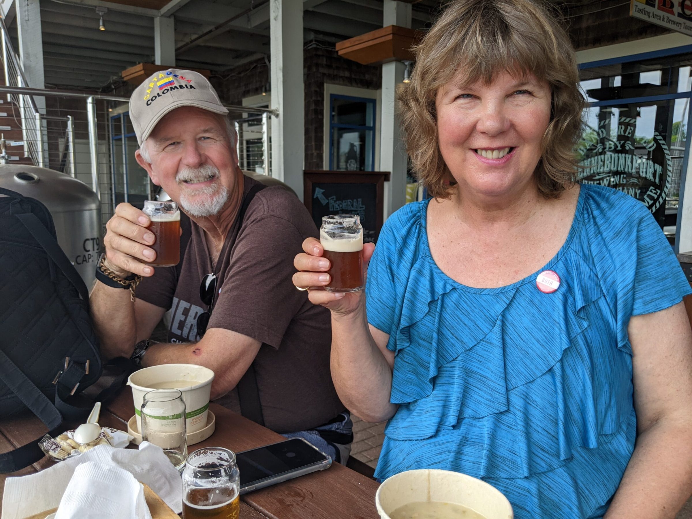 a man and a woman standing in front of a building