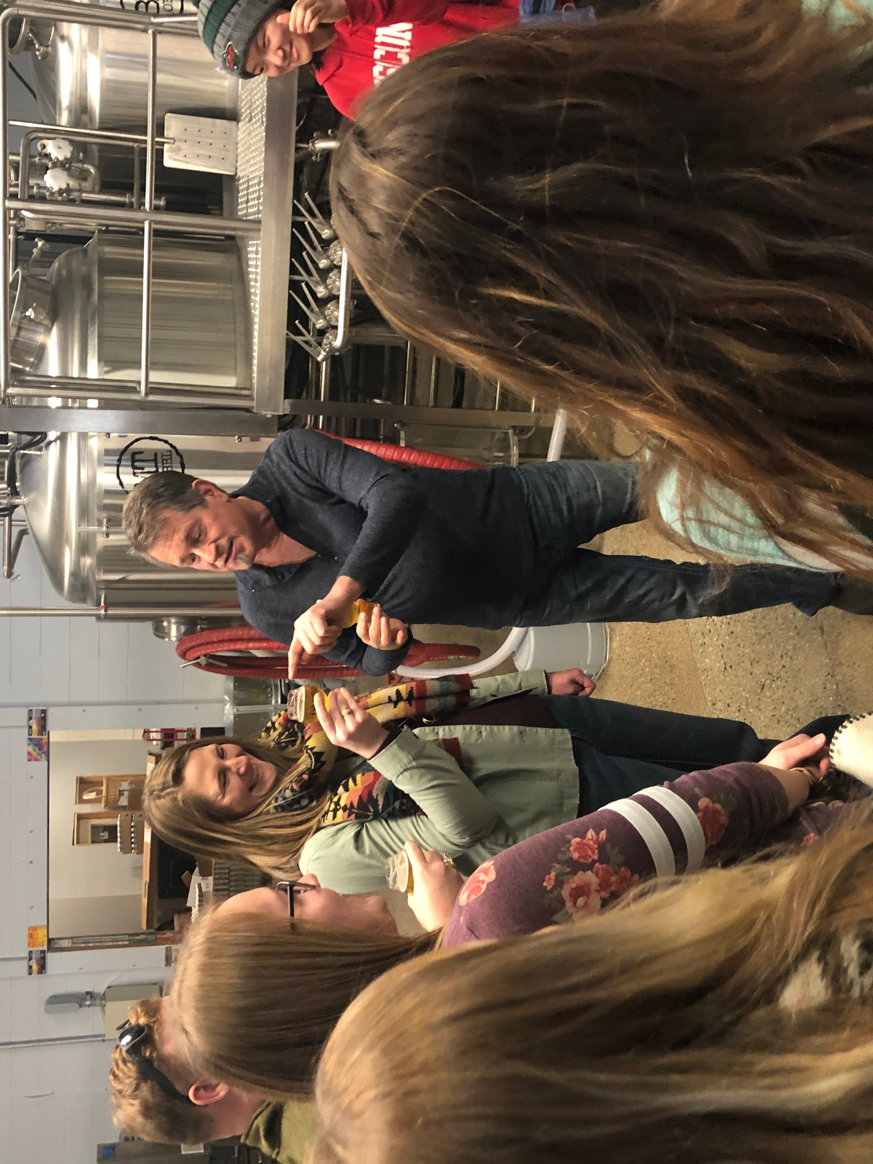 group of tour guests trying craft beer at brewery extrava