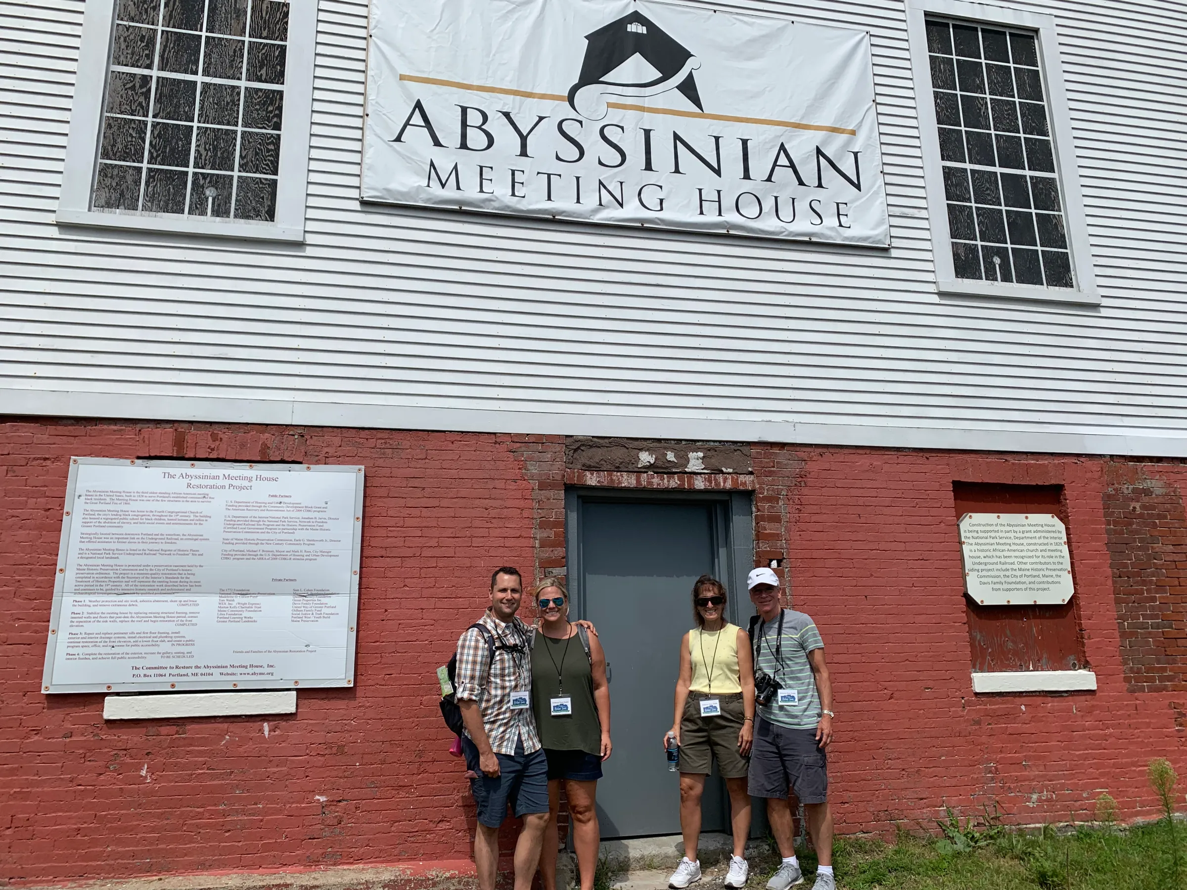 group of history tour guests outside a cultural heritage church