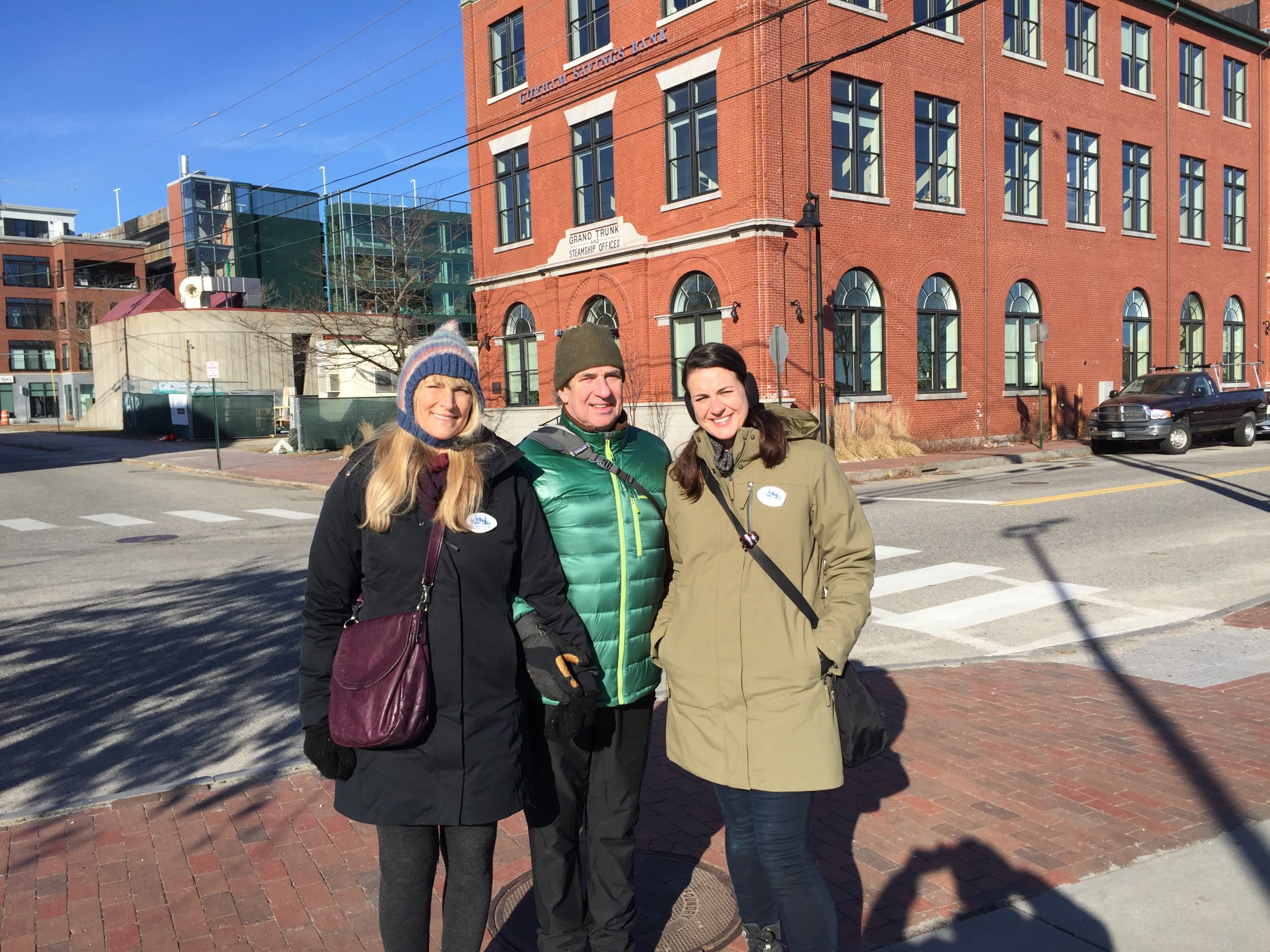 a woman standing in front of a building