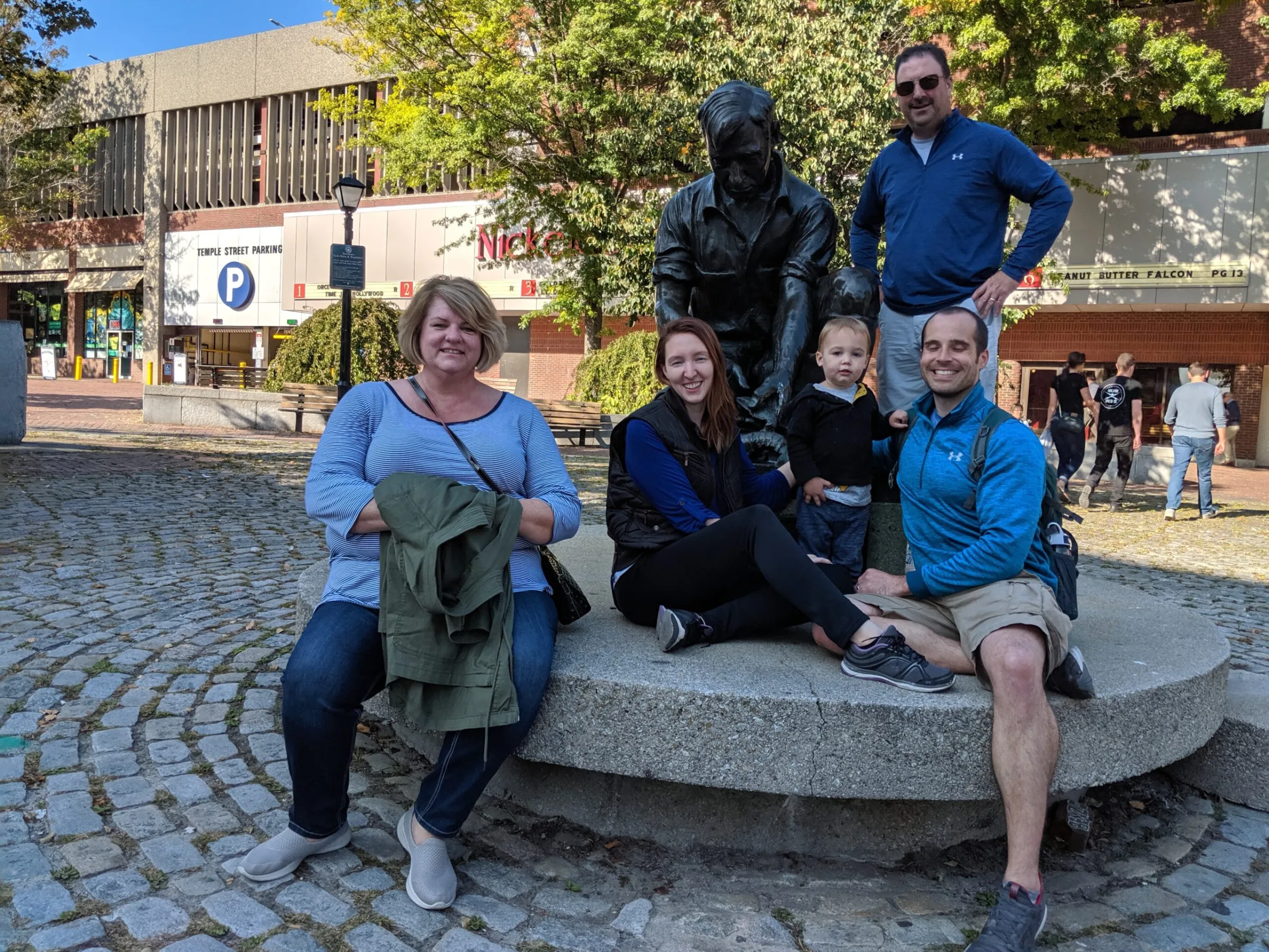 a group of people sitting on a bench