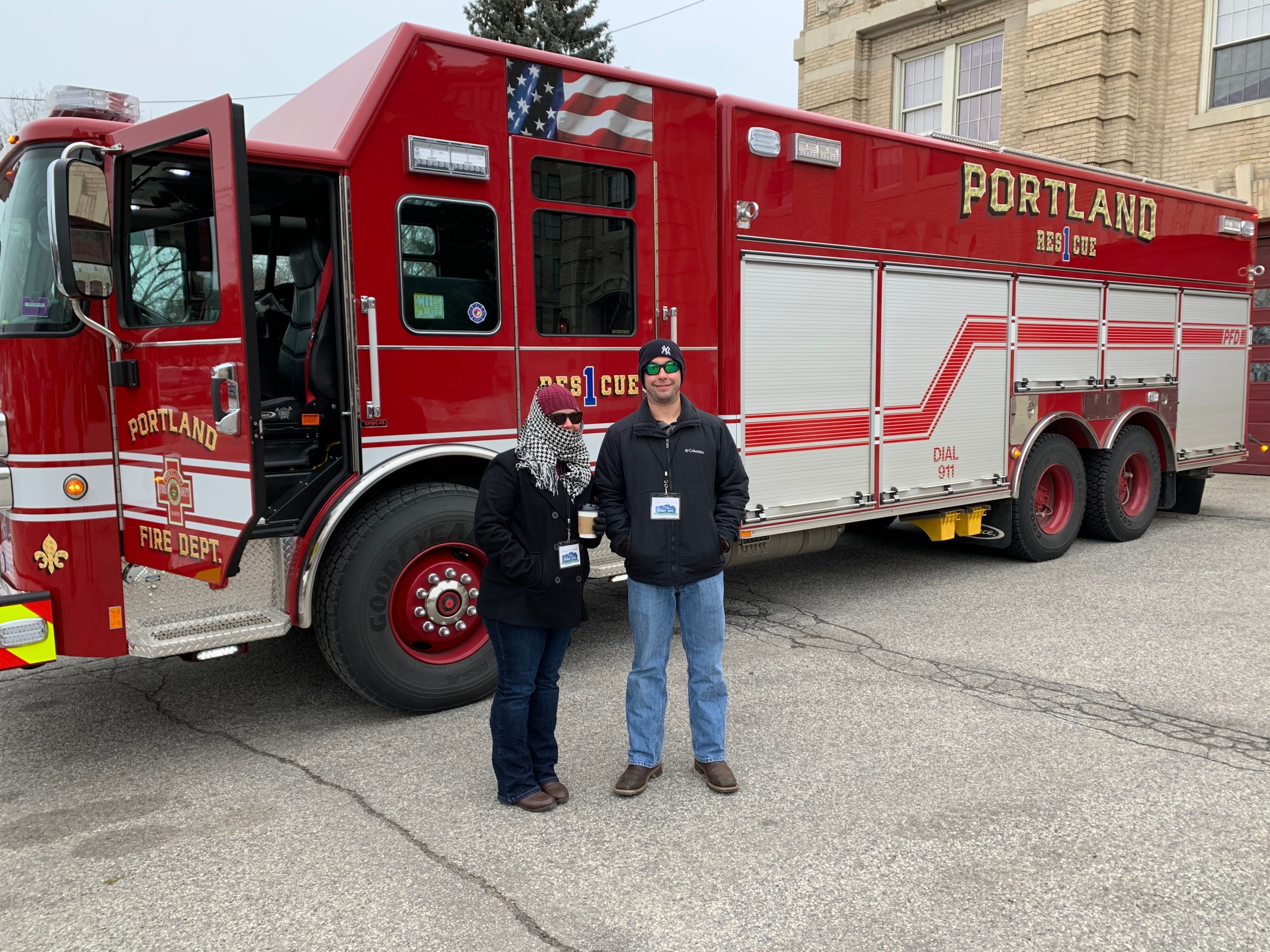 a red fire truck parked in front of a building