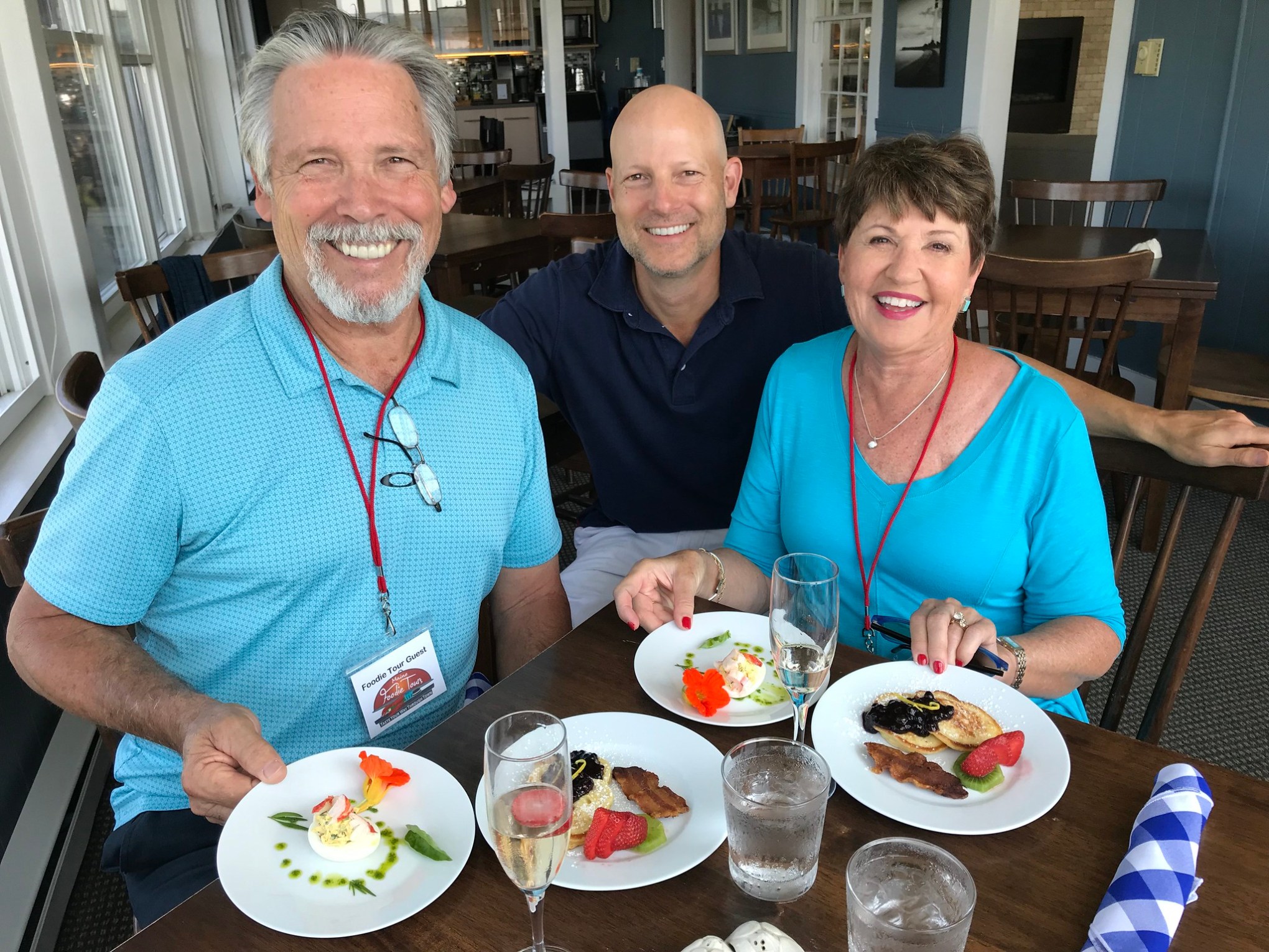 David Melby et al. sitting at a table with a plate of food