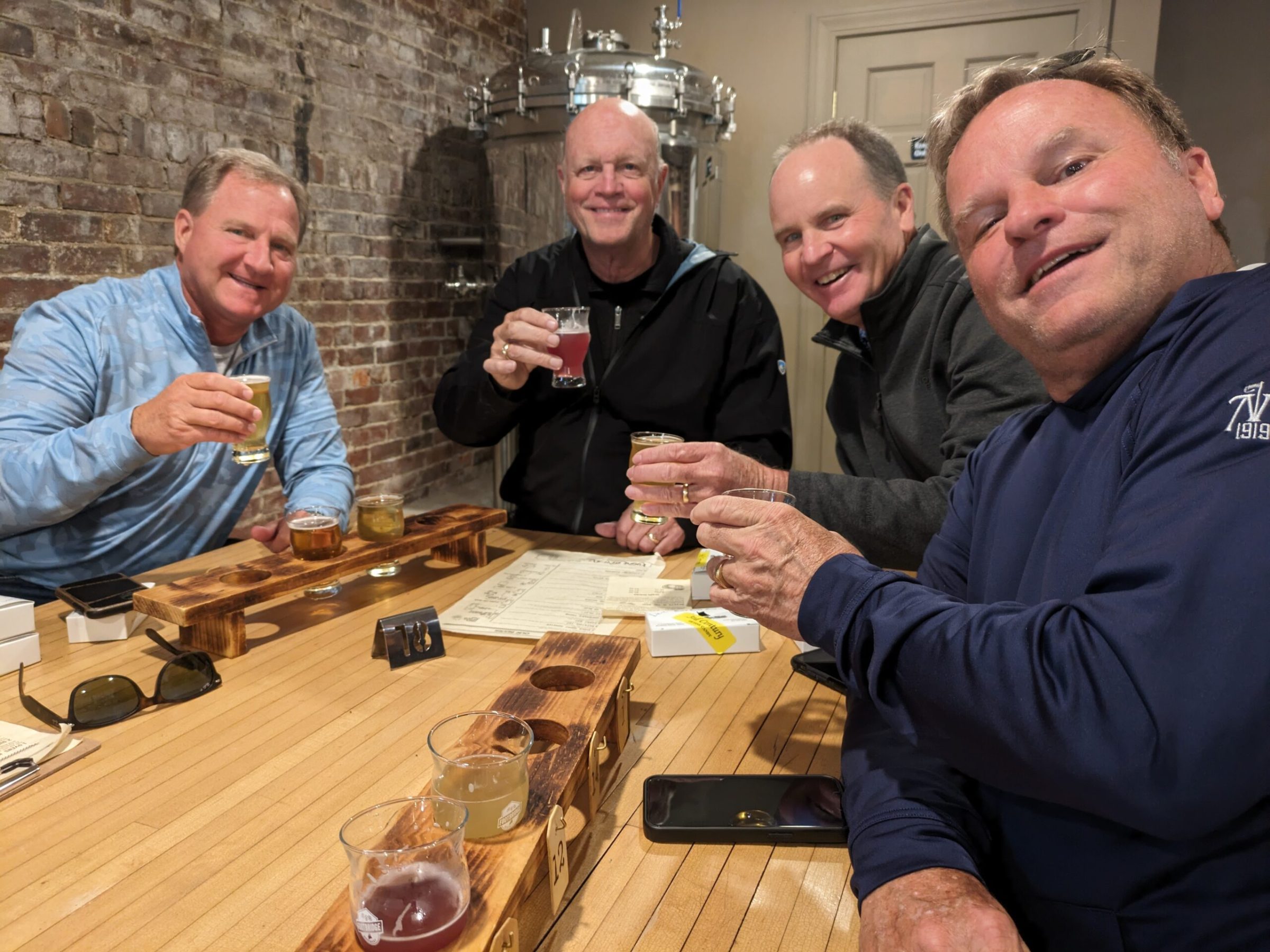 a group of people sitting at a table with wine glasses