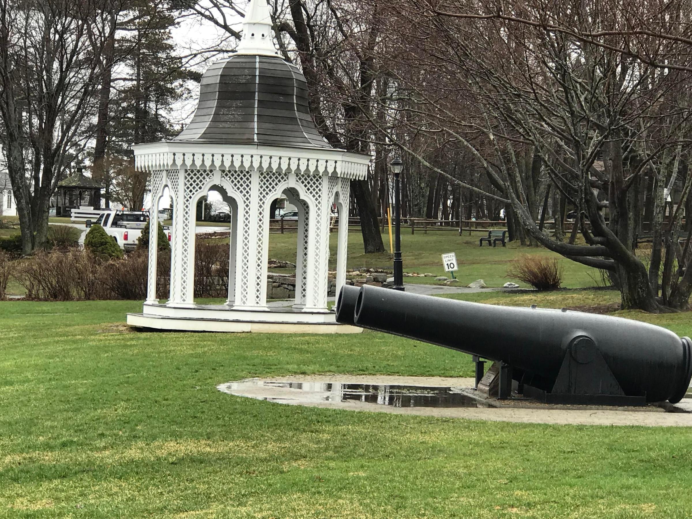 a large jetliner sitting on top of a grass covered field