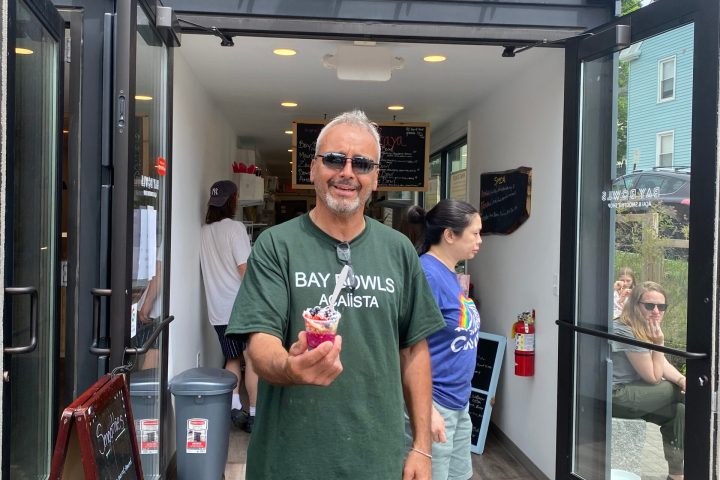 a man standing in front of a building