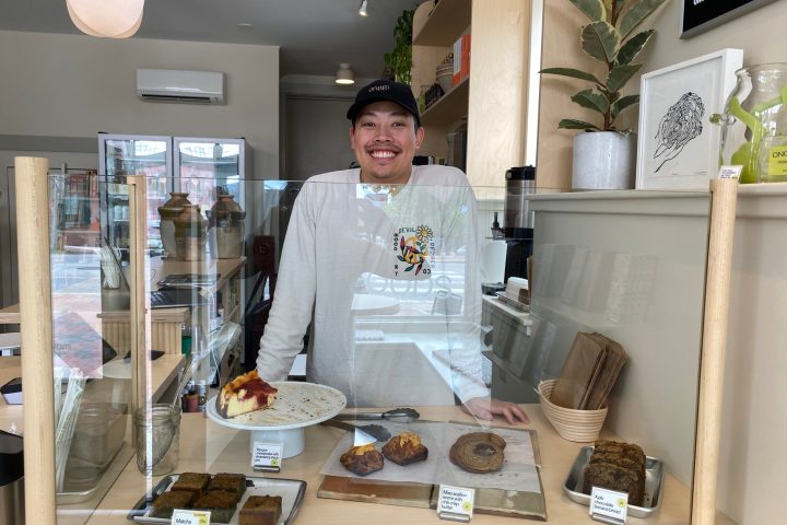 a person sitting at a table with food