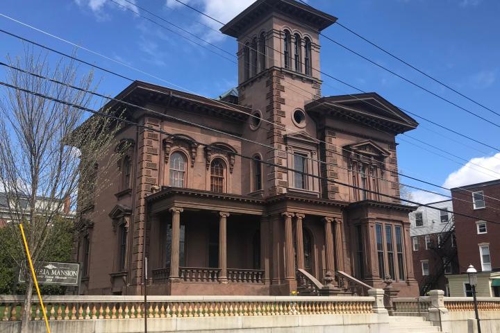 a group of people standing in front of a building