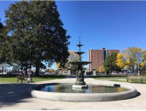 a man doing a trick on a skate board at a skate park
