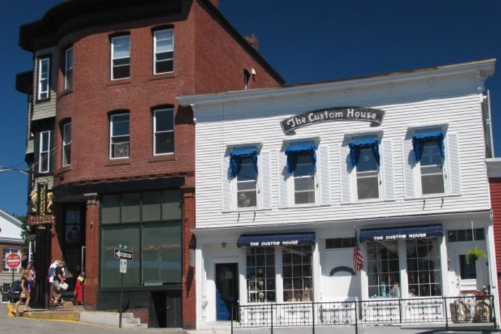 a close up of a street in front of a brick building
