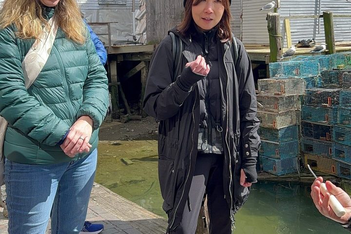 a group of people standing outside of a building