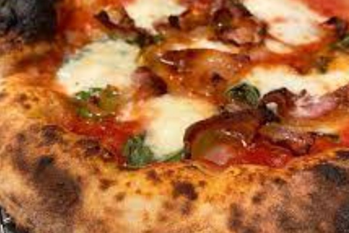 a pizza sitting on top of a pan