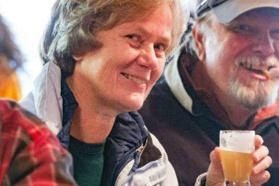 a man and a woman looking at the camera