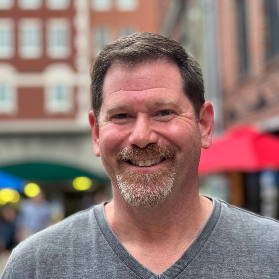 a man standing in front of a building
