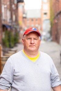 a man standing in front of a building