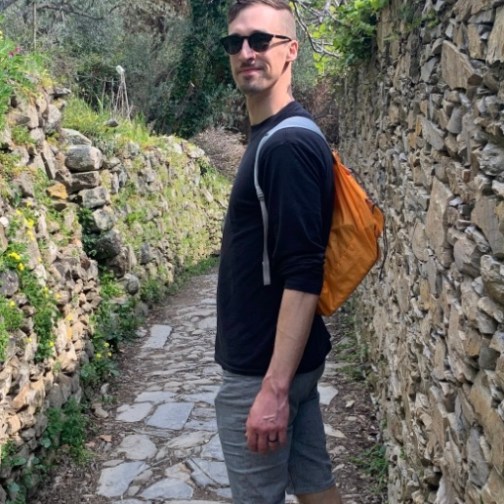 a man standing on a rocky path