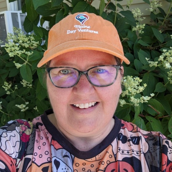 a man wearing a hat and glasses