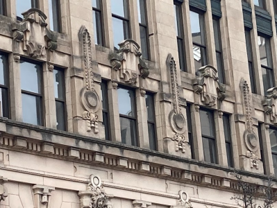 a large clock mounted to the side of a building