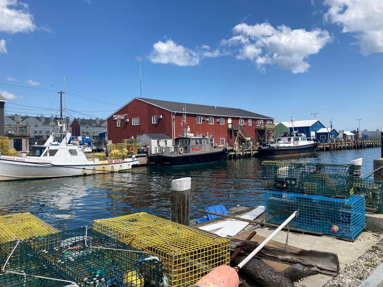 a boat is docked next to a body of water