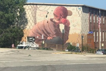 a man standing in front of a building