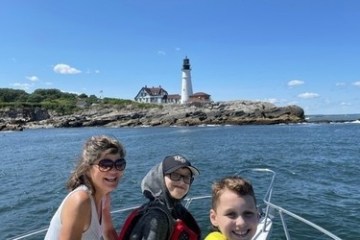 a couple of people that are standing in a body of water