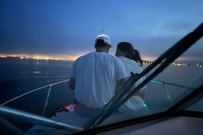 a man riding on the back of a boat
