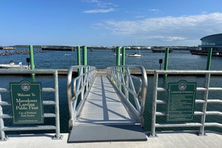 a bench next to a body of water