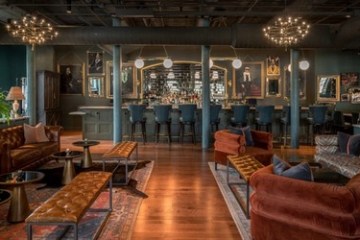 a living room filled with furniture and a fire place