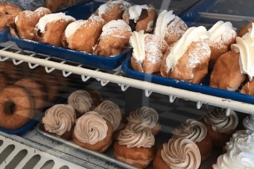 a group of plastic containers filled with food