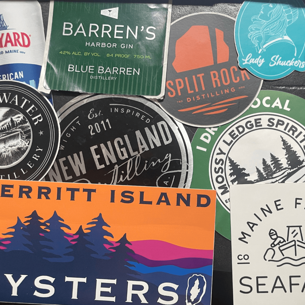 Stickers of different brewers, oyster farmers, and vendors from OysterFest.
