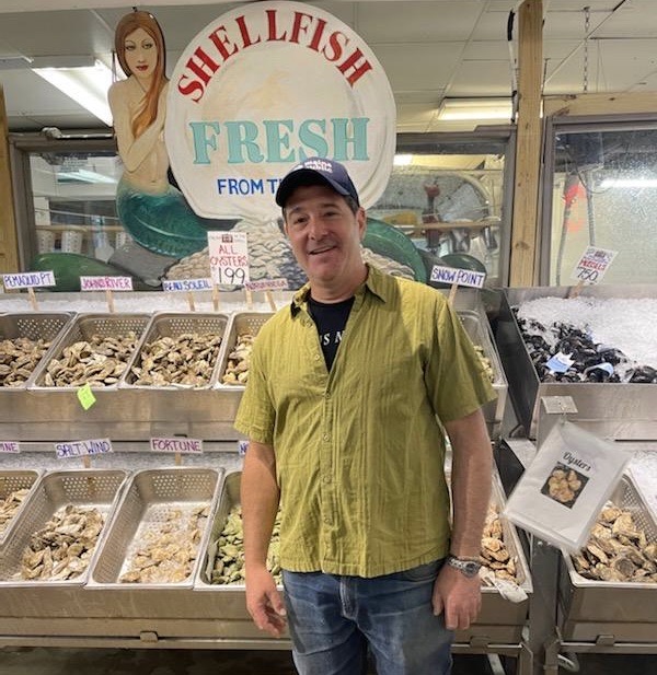 a man standing in front of a store